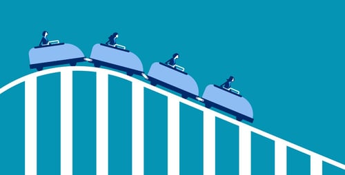 Business people going down roller coaster