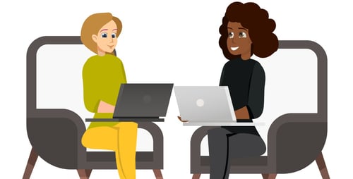 Two women with laptops at home
