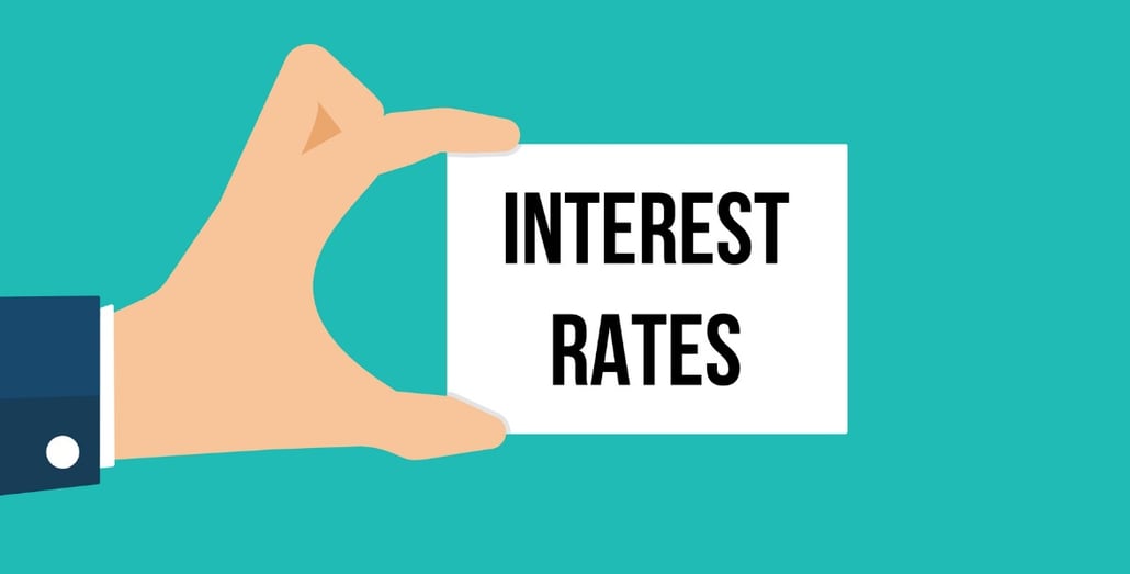 man-showing-paper-interest-rates